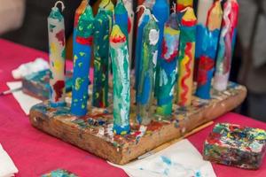 colorful handpainted candles on the table photo