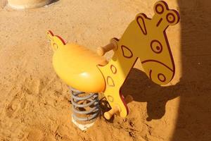 Toys and sports equipment on a playground in Israel. photo