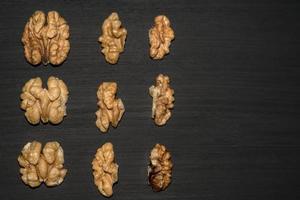 walnuts on black background. Top view with copy space for your text photo