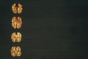 walnuts on black background. Top view with copy space for your text photo