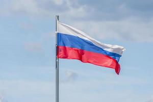 The National flag of Russia flay over the blue sky. Soft toned. photo