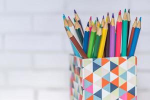 closeup of colorful pencils in pencil case photo