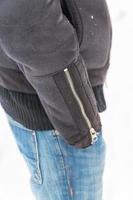 A man with his hand in jeans pocket on white background photo