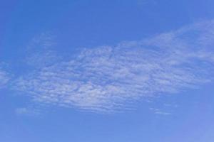 blye sky with white fluffy clouds background photo