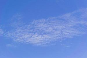 blye sky with white fluffy clouds background photo