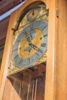 closeup of vintage wooden clock. Selective focus photo