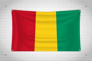 Guinea flag hanging on brick wall. 3D drawing. Flag attached to the wall. Neatly drawing in groups on separate layers for easy editing. vector