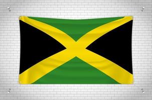 Jamaica flag hanging on brick wall. 3D drawing. Flag attached to the wall. Neatly drawing in groups on separate layers for easy editing. vector