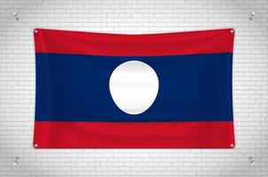 bandera de laos colgada en la pared de ladrillo. dibujo 3d bandera pegada a la pared. dibujar cuidadosamente en grupos en capas separadas para facilitar la edición. vector