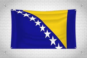 Bosnia and Herzegovina flag hanging on brick wall. 3D drawing. Flag attached to the wall. Neatly drawing in groups on separate layers for easy editing. vector