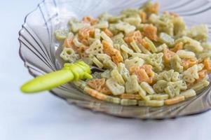 three colors pasta in transportation shape for children in a plate photo