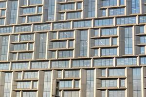 Modern office building with facade of metal and glass photo