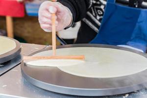 pancake cooked by a street vendor photo