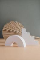 White concrete podium and palm leaf on grayand beige copy spase background. Minimal empty display product presentation scene. photo