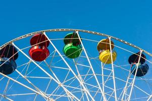 A colored ferris wheel in a children park, photo