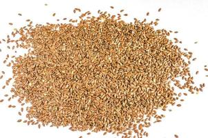 close up of flax seeds isolated on white background photo