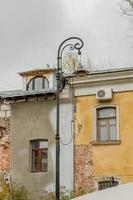 vintage street light on old building background photo