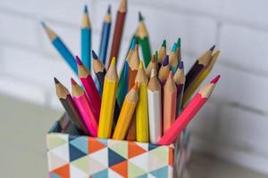 closeup of colorful pencils in pencil case photo