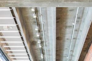 Industry building. Red brick wall , concrete and metal ceiling. photo