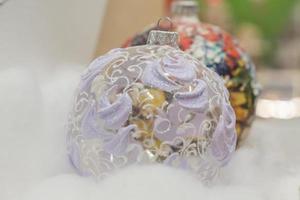 transparent christmas ball decorated with glitter photo