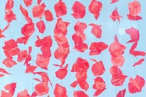 garland made of artificial rose petals. Flower background photo