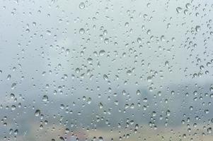 gotas de lluvia om fondo de ventana foto