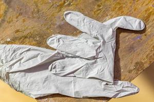 latex glove on wooden table photo