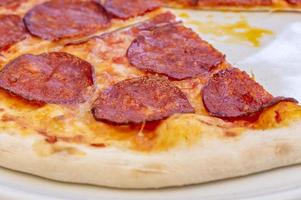 pepperoni pizza closeup, selective focus. photo