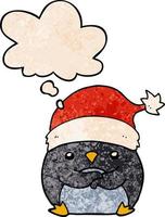 cute cartoon penguin wearing christmas hat and thought bubble in grunge texture pattern style vector