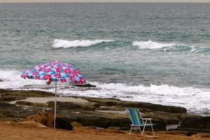 Umbrella for shelter from the sun on the city beach. photo