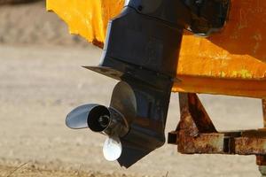 Motor and propeller of a motorboat. photo