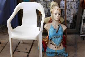 A mannequin stands on a showcase in a store. photo