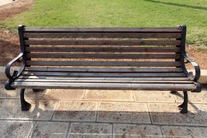 Bench in a city park on the Mediterranean coast photo