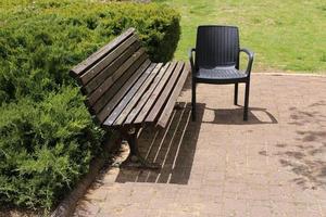 Bench for rest in the city park on the seashore. photo