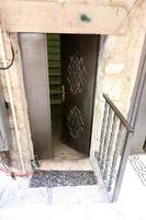 A door is an opening in a wall to enter and exit a building. photo