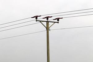Electric pole and wires carrying high voltage current photo
