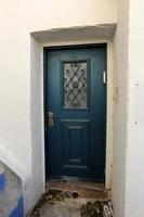 A door is an opening in a wall to enter and exit a building. photo