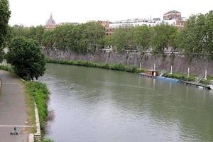 May 9, 2022 Tiber river Italy. Full-flowing river Tiber in the center of Rome. photo