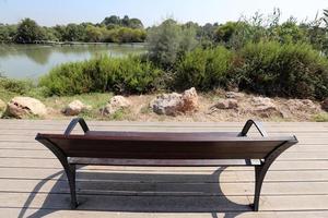 Bench in a city park on the Mediterranean coast photo