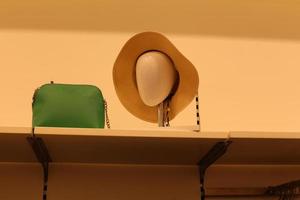 A mannequin stands on a showcase in a large store. photo