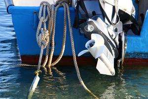 Motor and propeller of a motorboat. photo