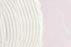 Cosmetic moisturizing cream for hands or face. Textured background. Strokes of cream. Copy space for text photo