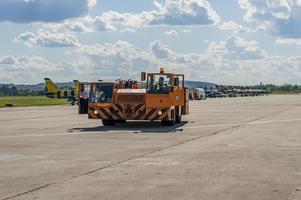 ZHUKOVSKY RUSSIA, JUlY 22, 2017 MAKS-2017 AIRSHOW TUG tow tractor on the airfield photo