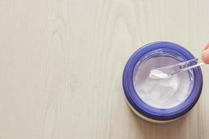 facial cream on wooden table. Cosmetic product photo