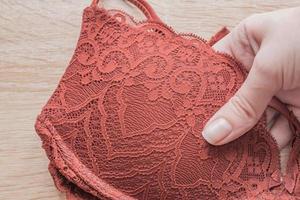 lace bra in wooman hand photo
