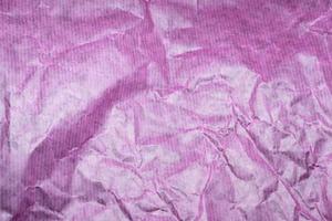 purple crumpled paper background photo