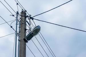 lamp post against gray sky photo