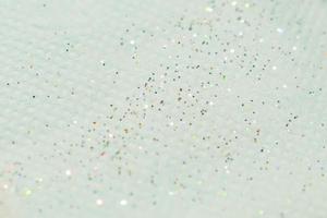 scattered glitter on textured paper photo