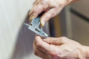 Man measures the diameter of the screw with Sliding caliper photo