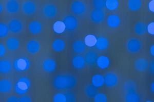 Decorative blue LED lights on wires - Defocused background photo